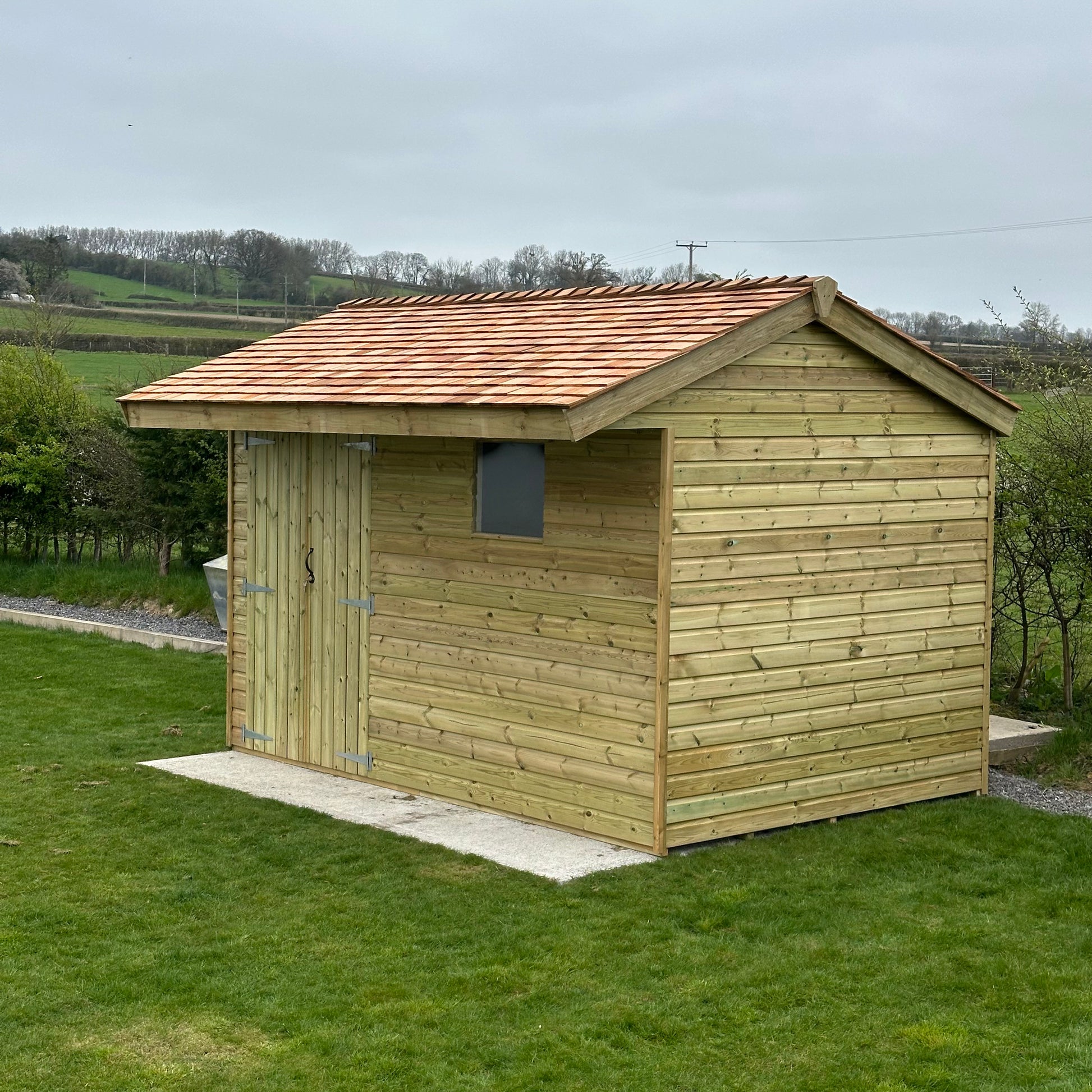 12x8 pent shed with a shingle roof and double doors