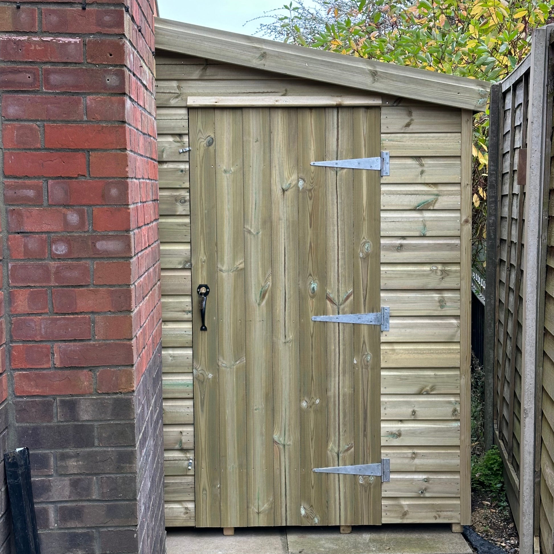 7x5 standard pent shed with a single door opening from the right. 